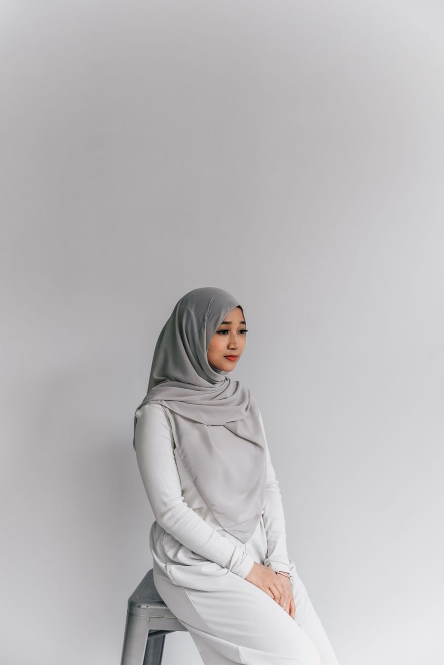Elegant woman in a soft grey hijab